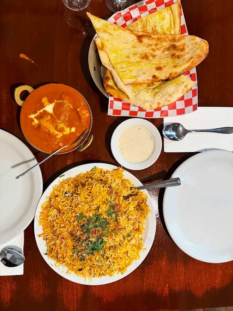 Biryani, butter chicken, and naan at Biryani Palace in Victoria
