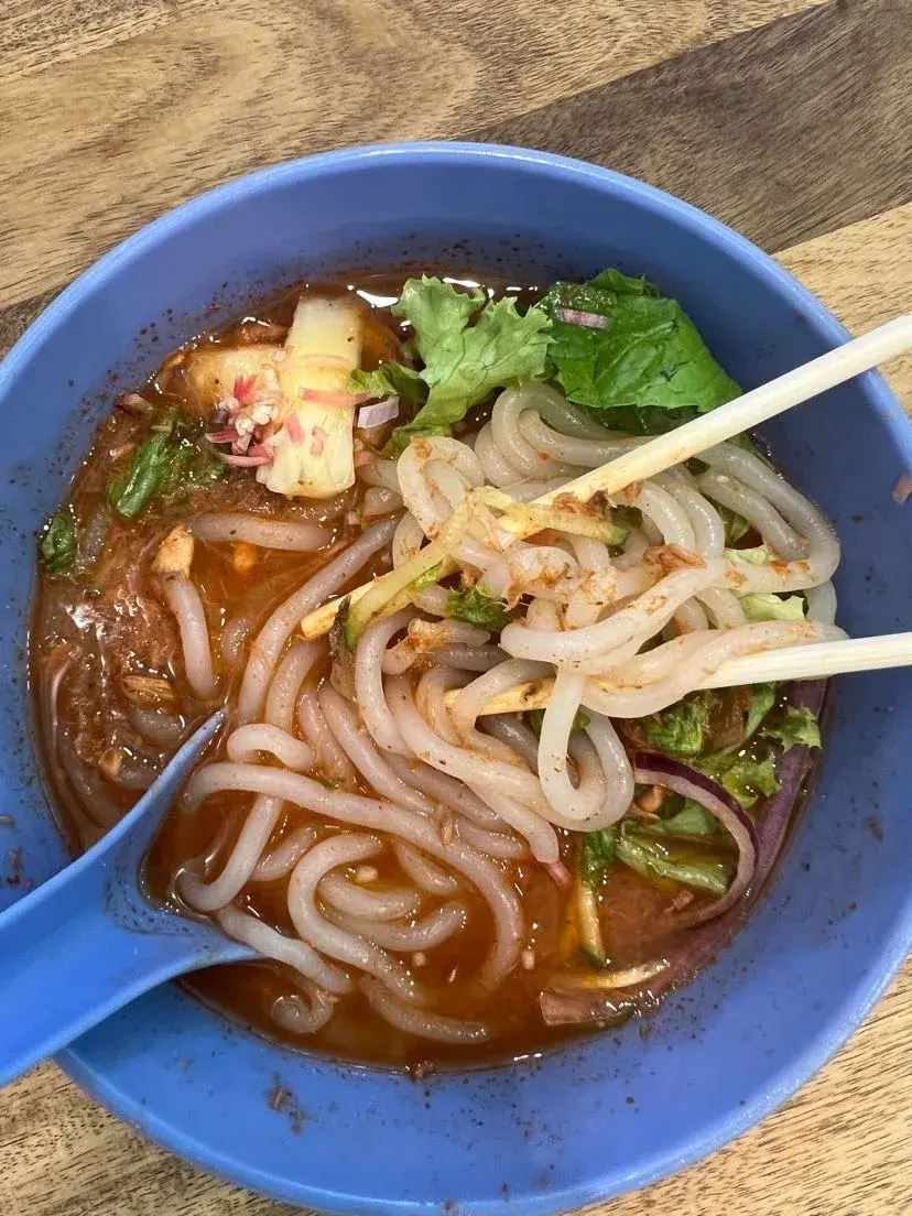 Bowl of sour Asam Laksa noodle soup