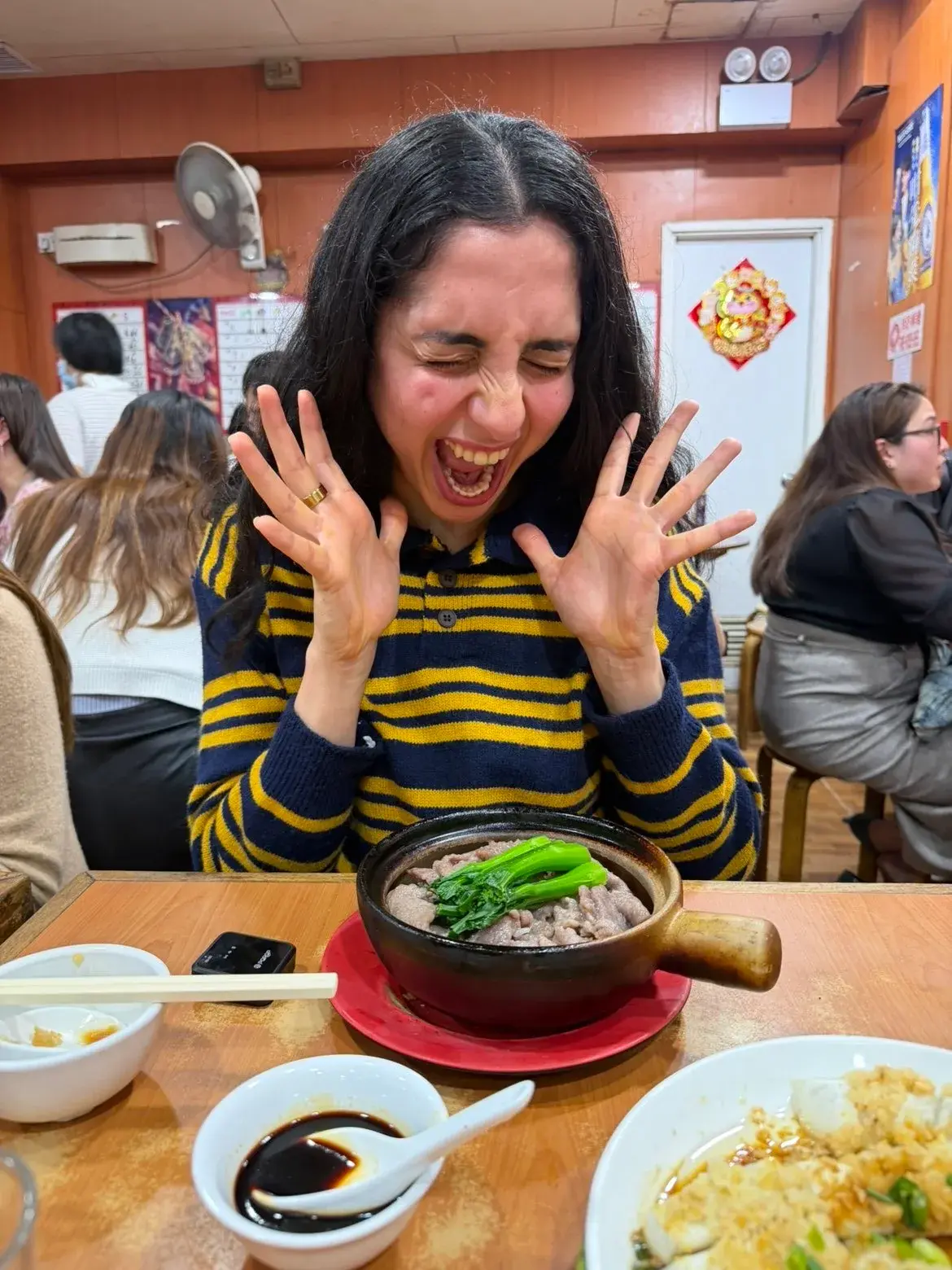 Deeva eating claypot rice