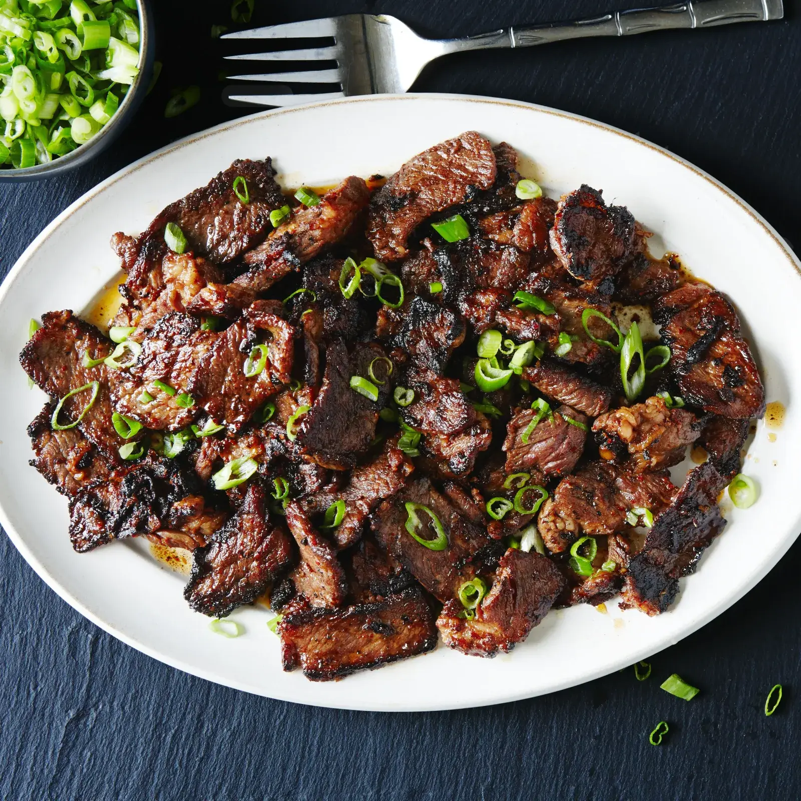 Plate of grilled bulgogi marinated beef with vegetables