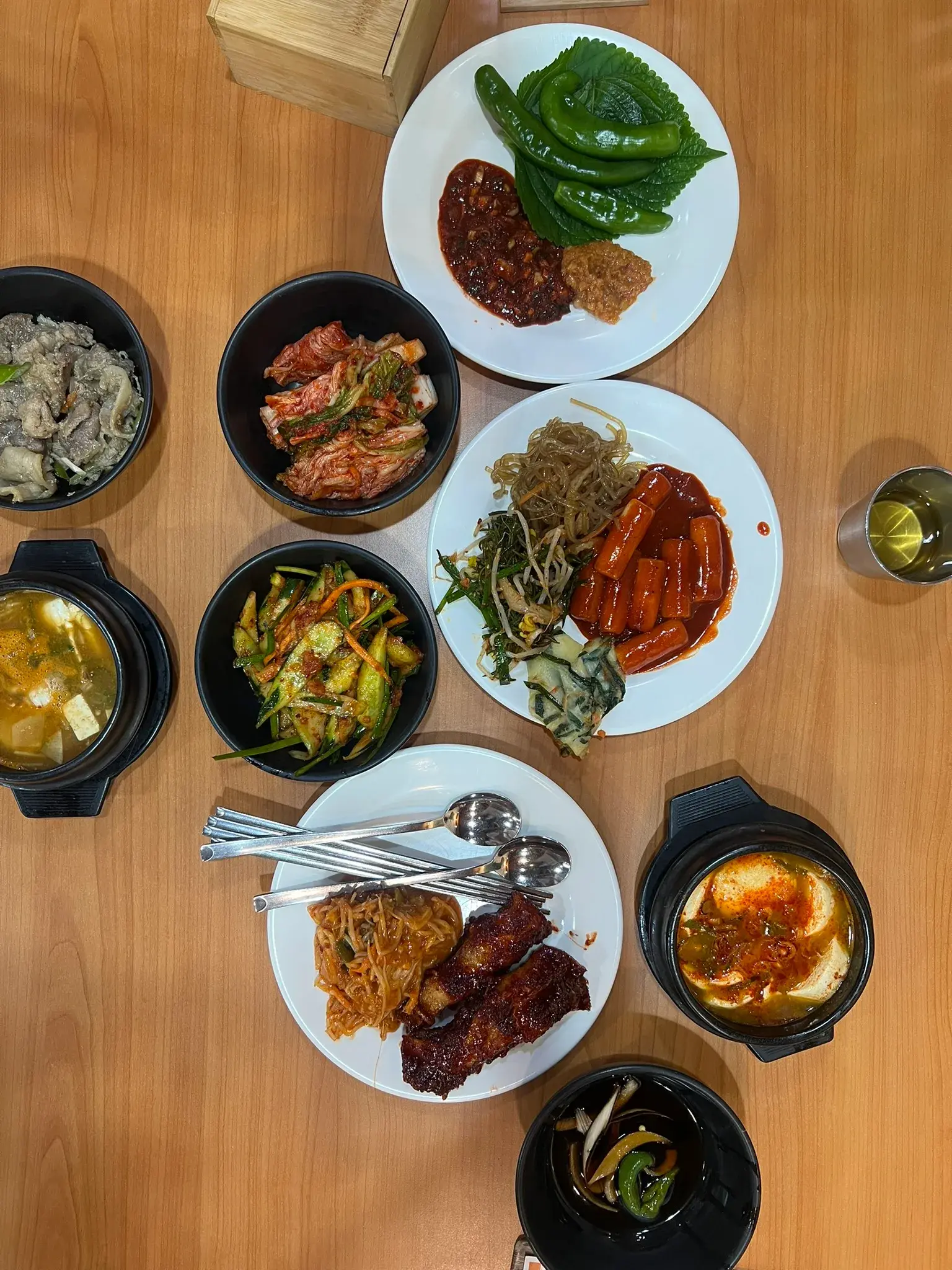 Jiggae along with a variety of Korean side dishes